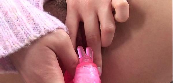  Using a pink dildo to get off on her hairy muff